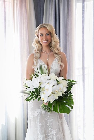 Beautiful bride with a. white bouquet at the Hyatt Regency Clearwater Beach.