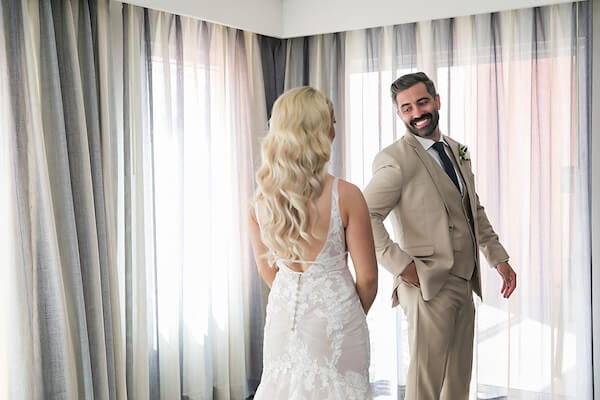 A bride and groom's first look at their Hyatt Regency Clearwater Beach.