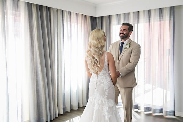 A bride and groom's first look at their Hyatt Regency Clearwater Beach.