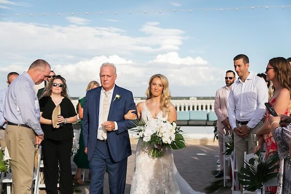 Bride walking down the aisle with her father.