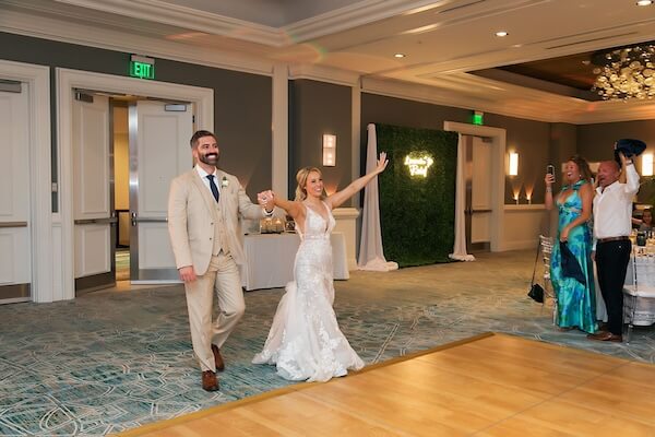 The bride and groom's grand entrance at their Hyatt Regency Clearwater Beach wedding reception.