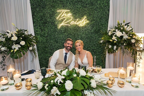 A happy bride and groom at their Hyatt Regency Clearwater Beach wedding reception.