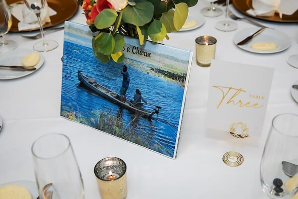 Wedding table numbers with photos of the couple.