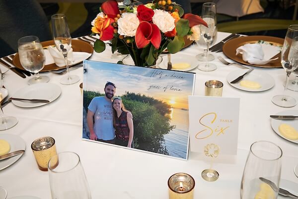 Wedding table numbers with photos of the couple.