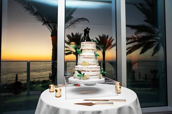 Wedding cake against the Clearwater Beach sunset at the Opal Sands.