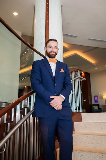 Groom on the staircase of the Opal Sands.