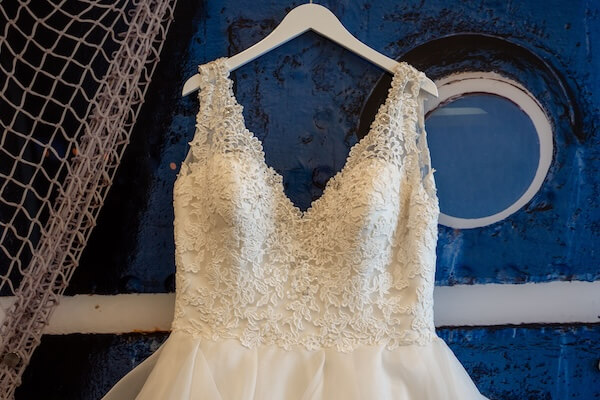 Bride's wedding gown against a blue background