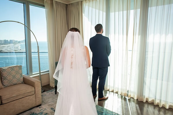 Bride and groom's first look at the Opal Sands.