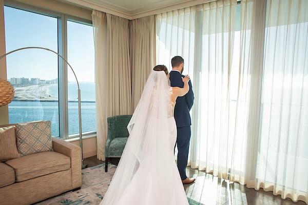 Bride and groom's first look at the Opal Sands.