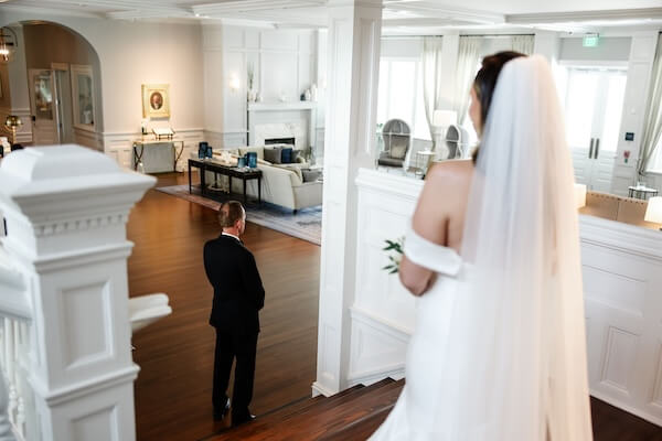 Bride getting ready for a first look with her father.