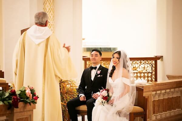 Bride and groom during a Catholic wedding ceremony in St. Petersburg, Florida.