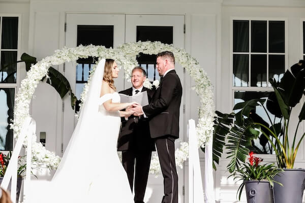 Bride and groom exchanging wedding vows.