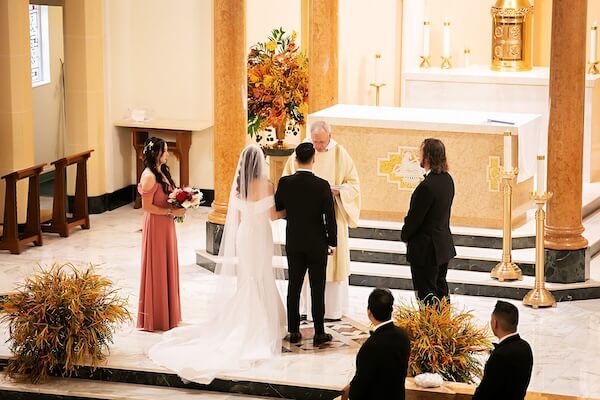 Bride and groom during a Catholic wedding ceremony in St. Petersburg, Florida.