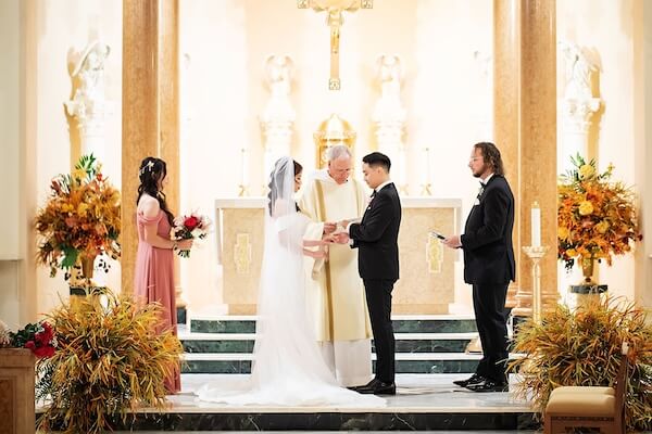 Bride and groom during a Catholic wedding ceremony in St. Petersburg, Florida.