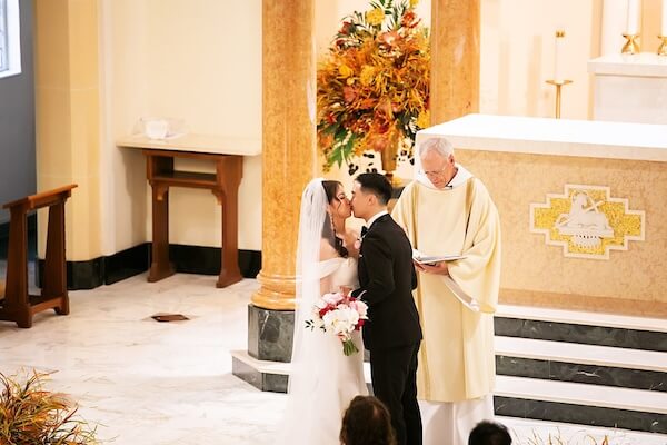 Bride and groom during a Catholic wedding ceremony in St. Petersburg, Florida.