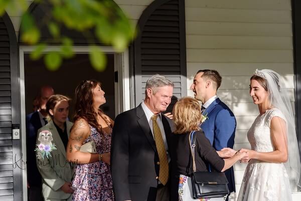 Bride and groom saying good bye to guests at the end of their afternoon wedding reception at Davis Islands Garden Club.