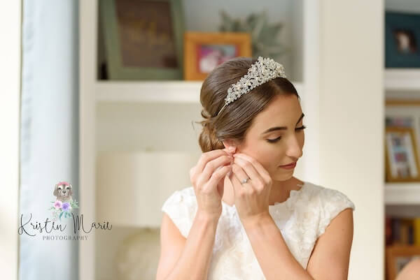 A bride adding poersonal touches to her wedding attire.