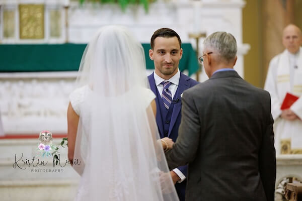 A groom awaiting his brides arrival.