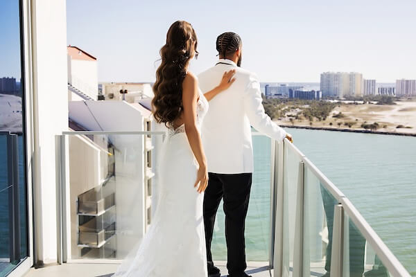 A bride and groom's first look overlooking Clearwater Beach and the Gulf of Mexico at the Opal Sands Resort.