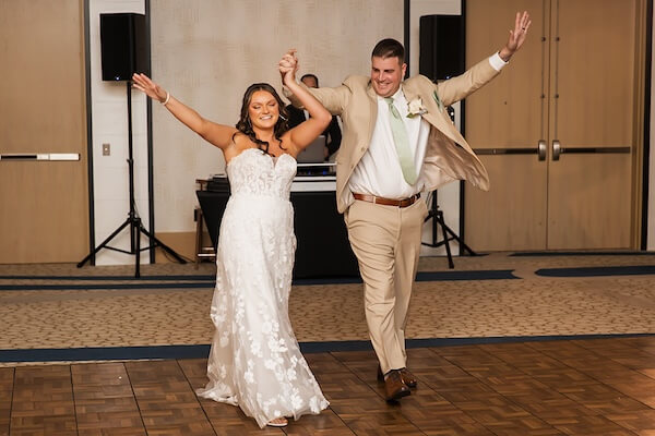 A newlywed couple making their entrance to their Wyndham Grand Clearwater Beach wedding reception.