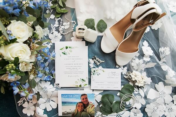 Wedding day accessories, flowers and invitations.