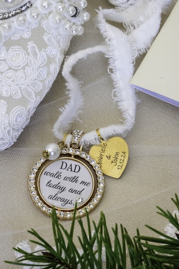 A special bouquet medallion remembering the bride's father.