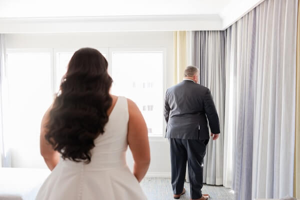 A bride's first look with her father before her Hyatt Regency Clearwater Beach wedding.