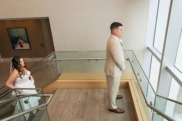 A bride and groom's first look before their Wyndham Grand wedding.