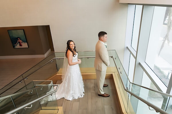 A bride and groom's first look before their Wyndham Grand wedding.