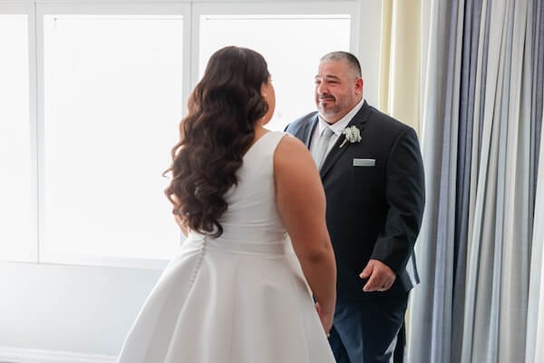 A bride's first look with her father before her Hyatt Regency Clearwater Beach wedding.