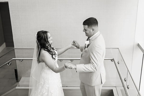 A bride and groom's first look before their Wyndham Grand wedding.