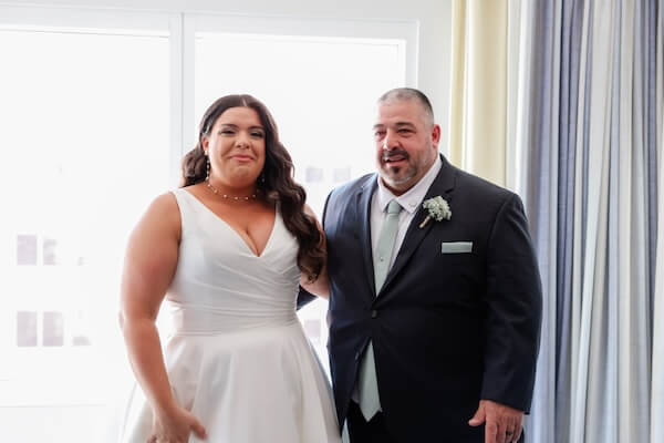 A bride's first look with her father before her Hyatt Regency Clearwater Beach wedding.