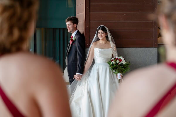 A bride and groom's first touch before their Clearwater wedding.