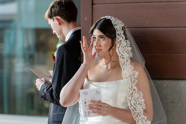 A bride and groom's first touch before their Clearwater wedding.
