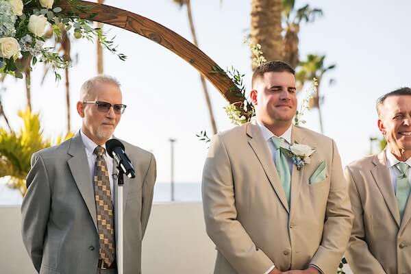 The groom waiting for his bride at their Wyndham Grand wedding ceremony on Clearwater Beach.