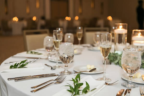 Tables are set for a Wyndham Grand wedding reception in Clearwater Beach, Florida.