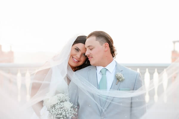 A bride and groom on the Hyatt Regency Clearwater Beach's Sky Terrace.