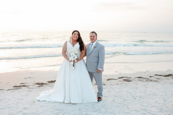 Newlyweds on Clearwater Beach at sunset.