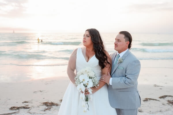 Newlyweds on Clearwater Beach at sunset.