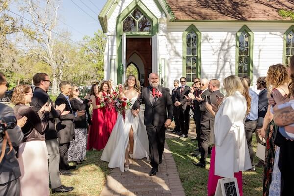 Newlyweds leaving the chaple after their Tampa Bay wedding
