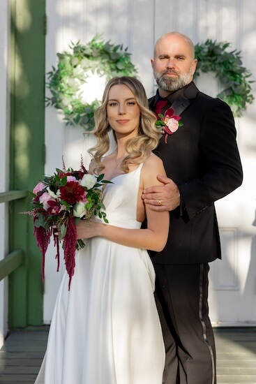 Bride and groom in front of Andrews Memorial Chapel in Dunedin, Florida.