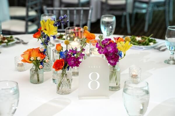 Bright sunset colored decor for a St. Pete wedding reception.