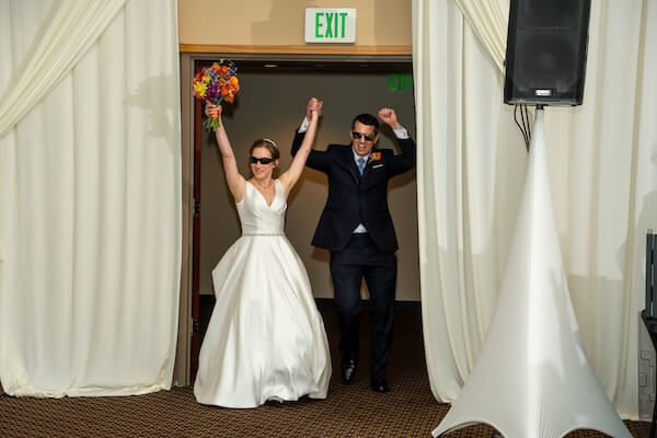 A newlywed couple entering their St. Pete wedding reception at the Mahaffey Theater.