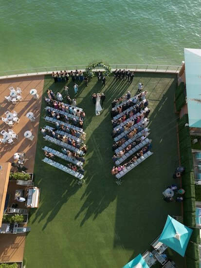 Overhead view of the bride walking down the aisle of her wedding ceremony at the Opal Sands Resort.