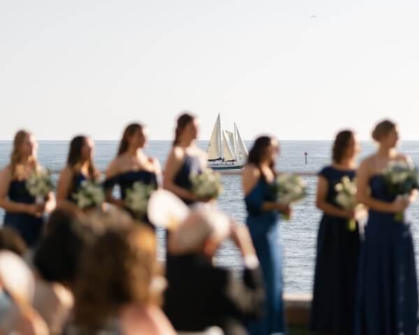 The wedding ceremony was held on the event lawn of the Opal Sands Resort.