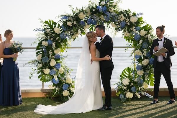 The wedding ceremony was held on the event lawn of the Opal Sands Resort.