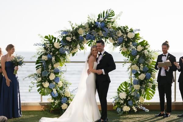 The wedding ceremony was held on the event lawn of the Opal Sands Resort.