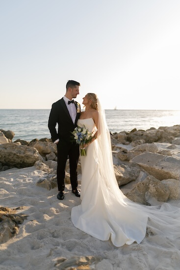 A newlywed couple's wedding portraits after their Opal Sands Resort wedding.