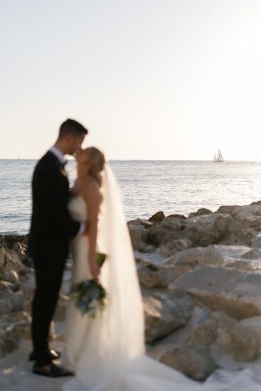 A newlywed couple's wedding portraits after their Opal Sands Resort wedding.