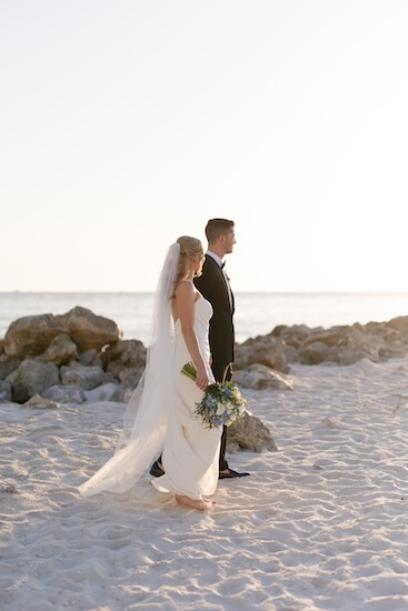 A newlywed couple's wedding portraits after their Opal Sands Resort wedding.